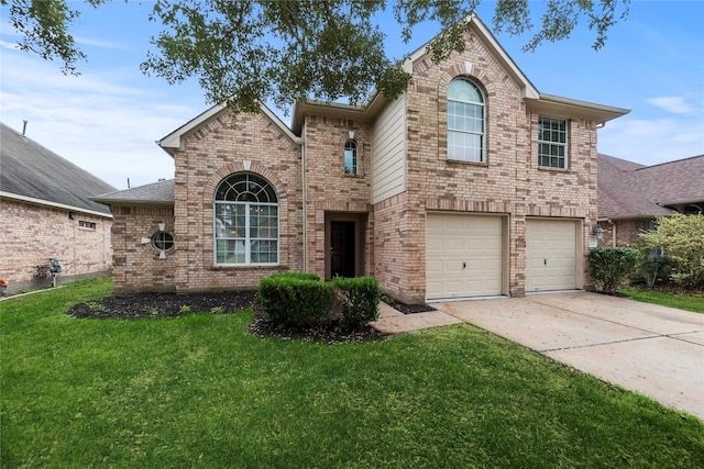 view of property featuring a garage and a front lawn