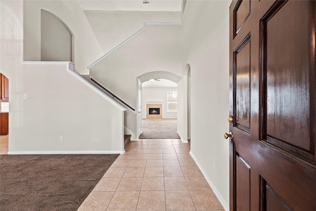 entrance foyer featuring light colored carpet