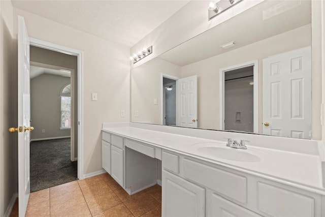 bathroom with vanity and tile patterned flooring