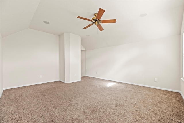 additional living space featuring ceiling fan, lofted ceiling, and carpet floors