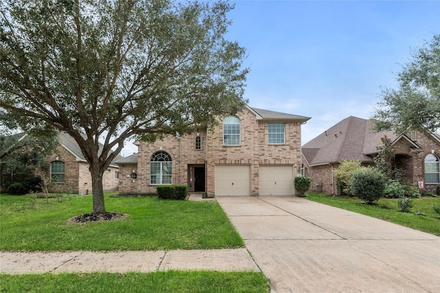 view of front of house featuring a garage and a front yard