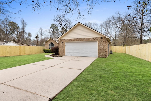 view of front of home with a garage and a front yard