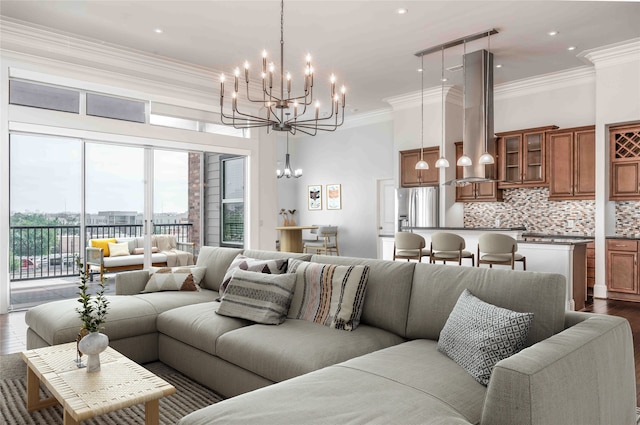 living room featuring ornamental molding, an inviting chandelier, and dark hardwood / wood-style flooring