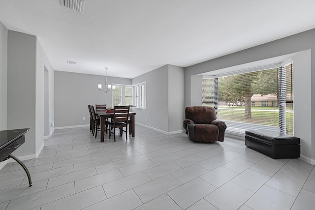 2507 Encreek Rd, Houston, TX 77068 - dining room with baseboards, a chandelier, and light tile patterned floors