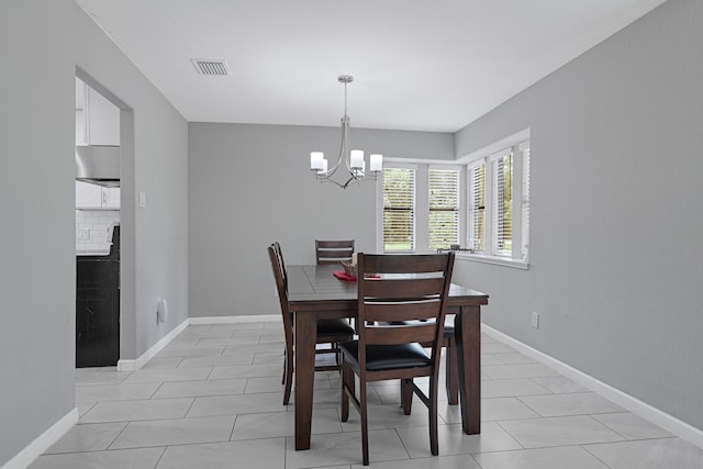 2507 Encreek Rd, Houston, TX 77068 - dining room with a chandelier, baseboards, and light tile patterned floors