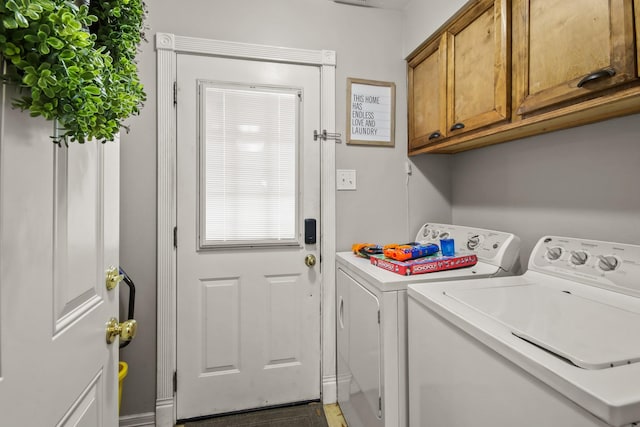 laundry area with cabinet space and washer and clothes dryer