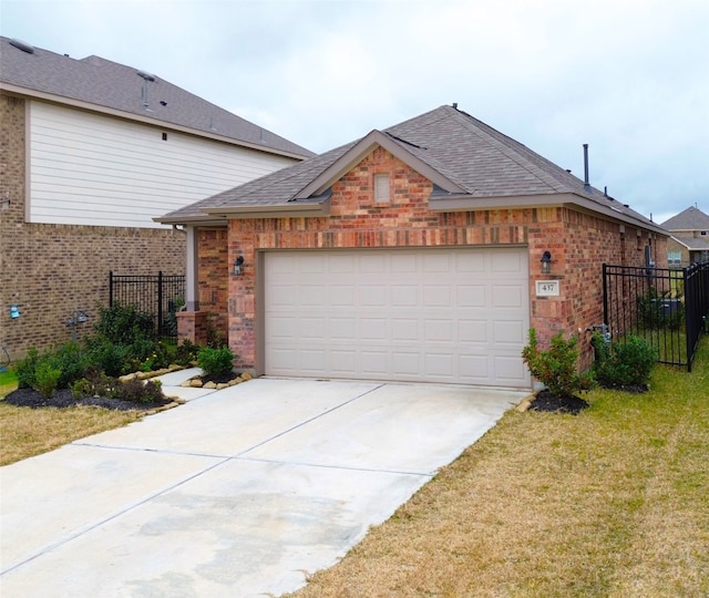 view of front of home with a garage and a front lawn