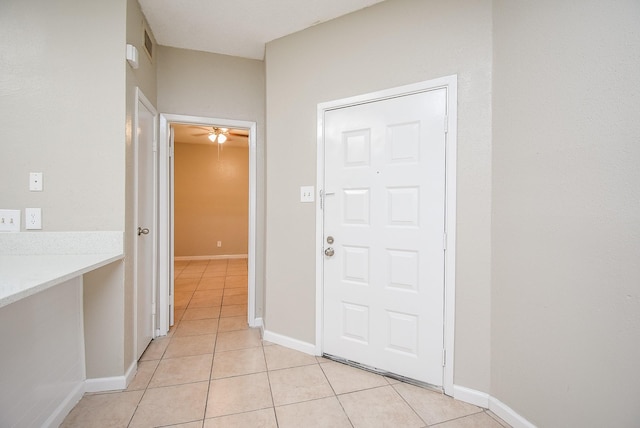 hallway featuring light tile patterned floors