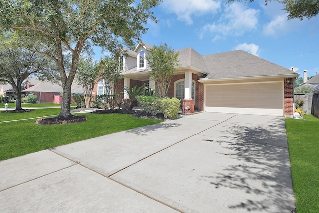 view of front of property with a garage and a front yard