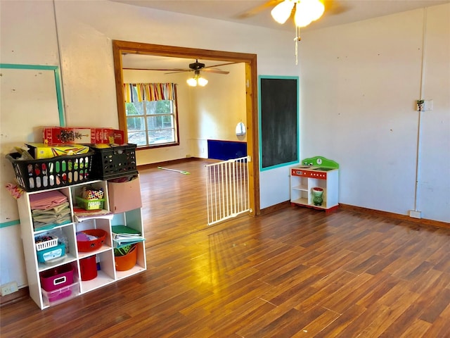 rec room featuring wood-type flooring and ceiling fan