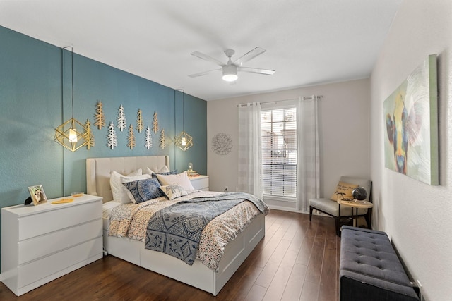 bedroom with ceiling fan and dark hardwood / wood-style floors