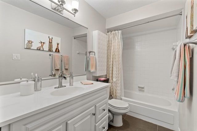 full bathroom featuring vanity, shower / bath combo, and toilet