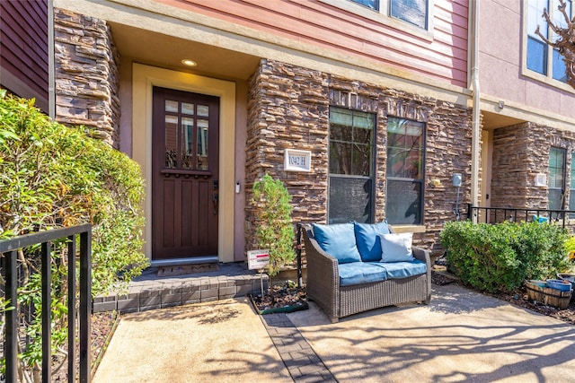 doorway to property featuring outdoor lounge area and a patio