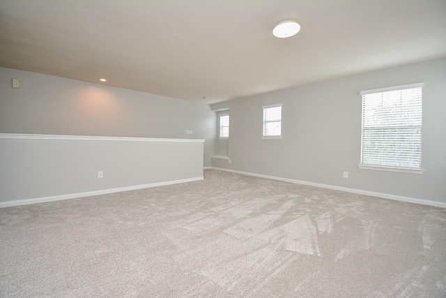 empty room featuring light colored carpet