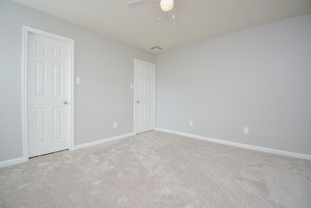 carpeted empty room with ceiling fan