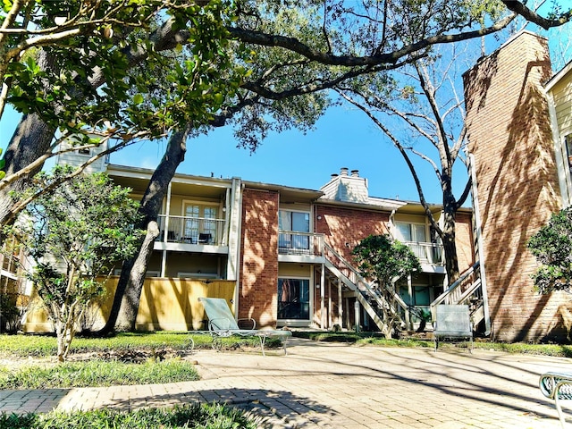 view of property with stairway