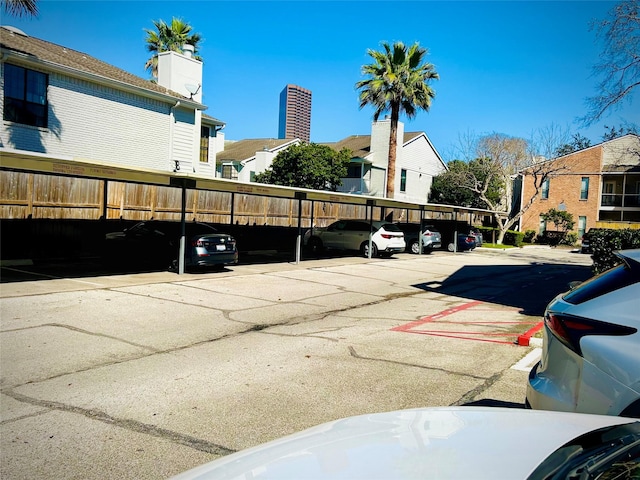 covered parking lot with fence