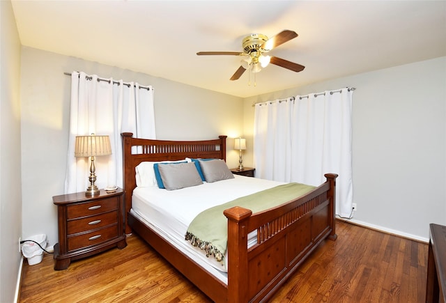 bedroom featuring ceiling fan and dark hardwood / wood-style flooring