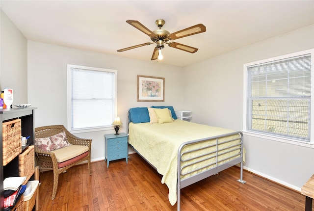 bedroom featuring hardwood / wood-style flooring and ceiling fan