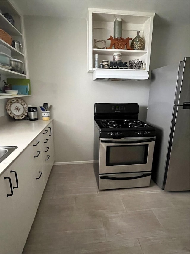 kitchen featuring appliances with stainless steel finishes and white cabinetry