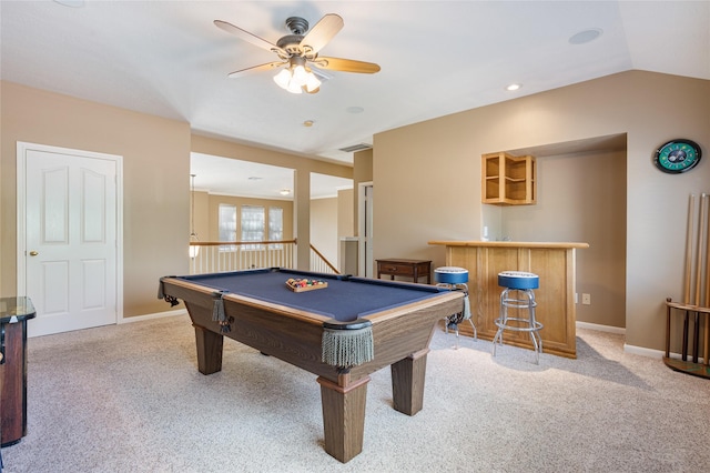 playroom with lofted ceiling, a bar, carpet, and baseboards