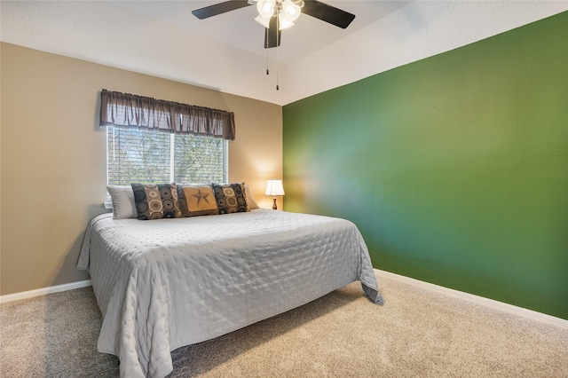 bedroom with carpet floors, a ceiling fan, and baseboards