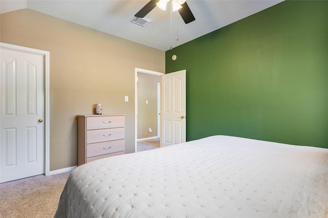 carpeted bedroom with a ceiling fan, visible vents, vaulted ceiling, and baseboards