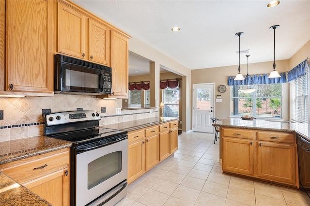 kitchen with light tile patterned floors, decorative backsplash, dark stone counters, black appliances, and pendant lighting