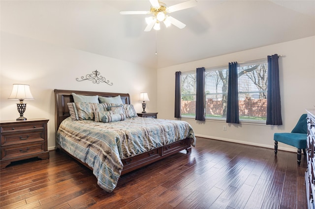 bedroom with ceiling fan, vaulted ceiling, baseboards, and dark wood finished floors