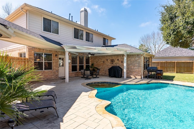 view of swimming pool featuring a patio, a fenced backyard, grilling area, a fenced in pool, and a pergola