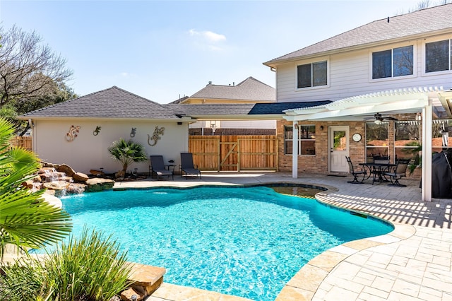 view of swimming pool featuring a fenced in pool, fence, a patio, and a pergola