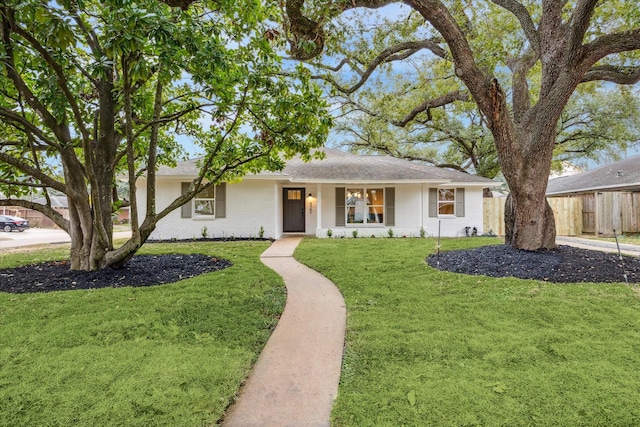 single story home featuring a front yard