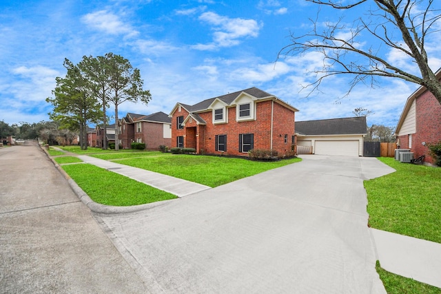 view of front of home with a garage and a front lawn