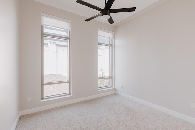 spare room with light carpet and ceiling fan