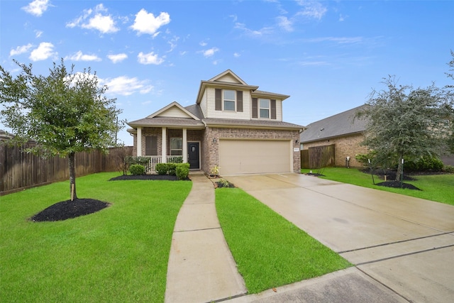 view of front of property with a garage, a front yard, and covered porch