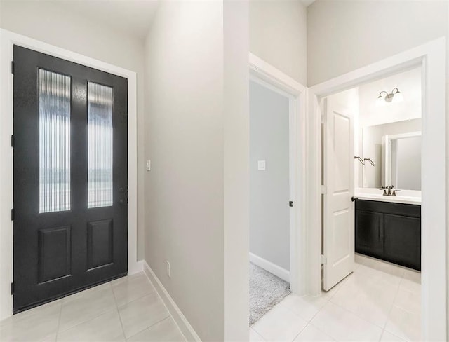 tiled entrance foyer with sink