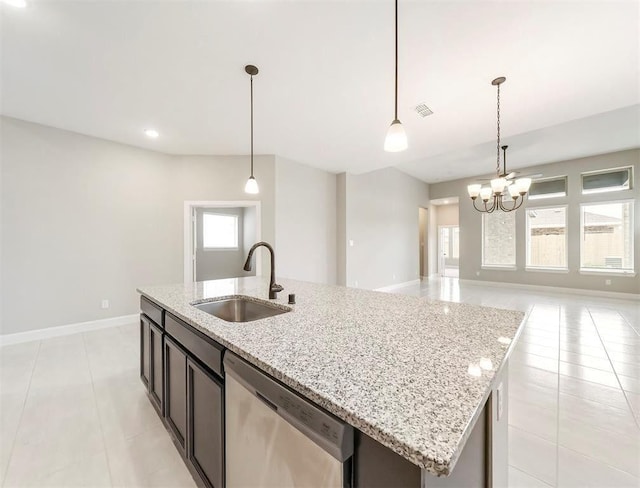 kitchen featuring sink, dishwasher, light stone counters, a center island with sink, and decorative light fixtures