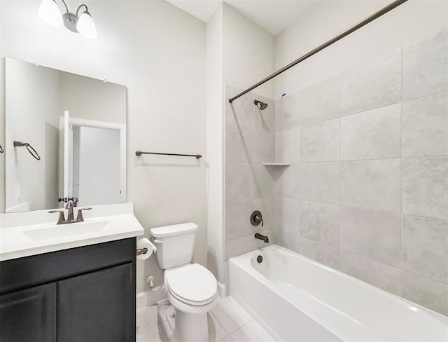 full bathroom with tiled shower / bath, vanity, tile patterned floors, and toilet