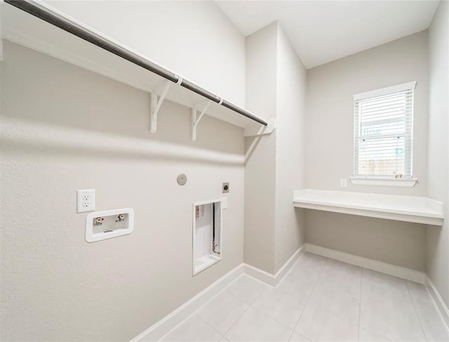 laundry area with washer hookup, hookup for a gas dryer, light tile patterned floors, and electric dryer hookup