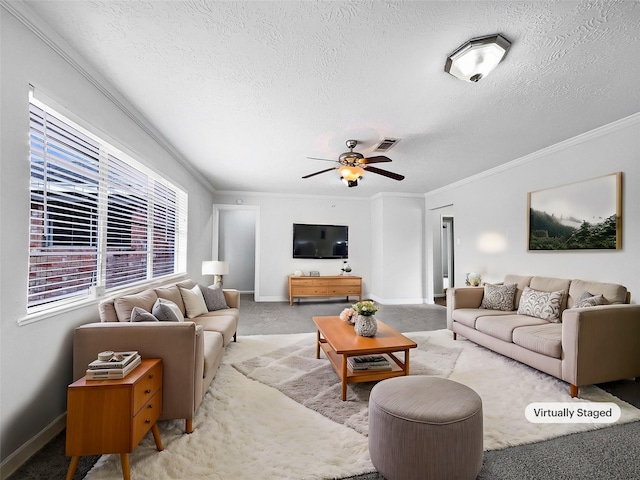 carpeted living room with ceiling fan, ornamental molding, and a textured ceiling