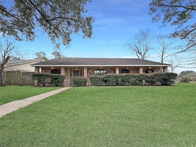 ranch-style house with a front lawn