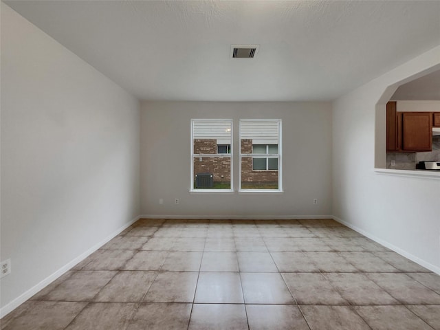 unfurnished room with light tile patterned floors