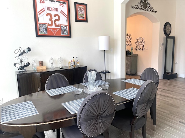 dining space featuring light wood-type flooring