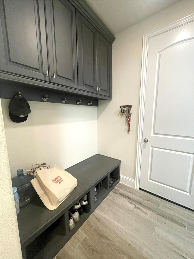 mudroom with light hardwood / wood-style floors