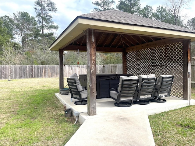 view of patio featuring a gazebo and a hot tub