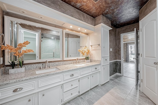 bathroom featuring vanity and a shower