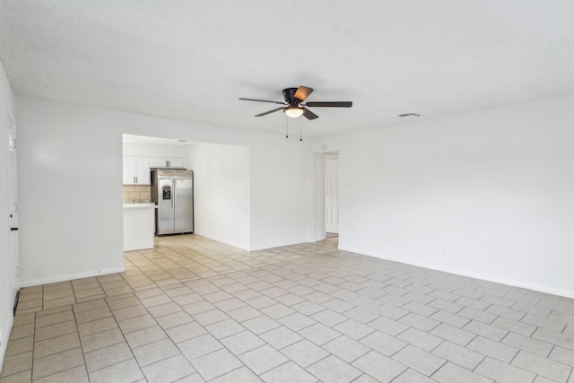 spare room with ceiling fan