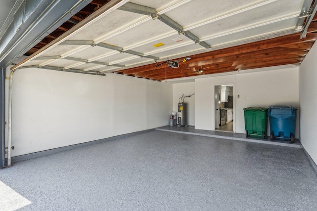 garage with water heater and a garage door opener