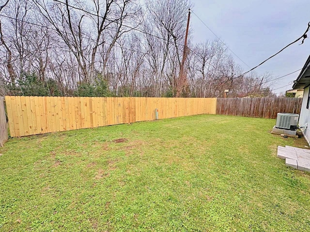 view of yard featuring central air condition unit