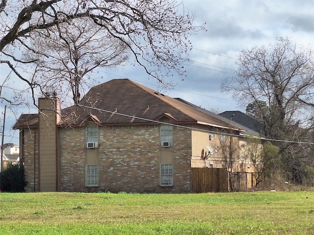 view of home's exterior featuring a yard